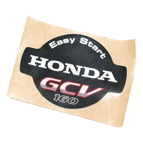 This is a genuine Honda 87169-Z8B-000 MARK, RECOIL COVER (GCV160)